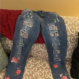 EUC women’s jeans with floral leopard details.